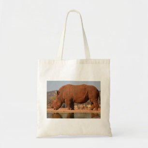 Rhino with mud on skin photo tote bag