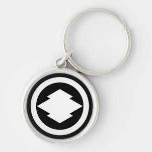Rhombic pine bark in circle key ring