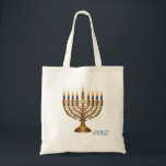 Rich Blue & Gold Jewelled Hanukkah  Tote Bag<br><div class="desc">Celebrate the Festival of Lights in opulence with this beautifully designed rich blue and gold Hanukkah menorah holiday postcard! This flat postcard features a stunning, detailed illustration of an ornate, antique-style gold Hanukkah menorah, lavishly adorned with vibrant multi-coloured gems and delicate enamel work. The menorah is fully lit with nine...</div>