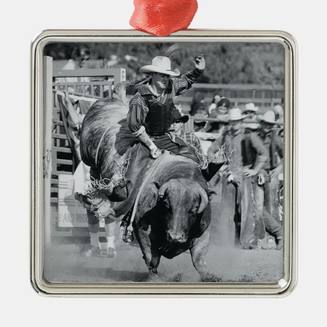 Rider hanging on to bucking bull metal tree decoration (Front)