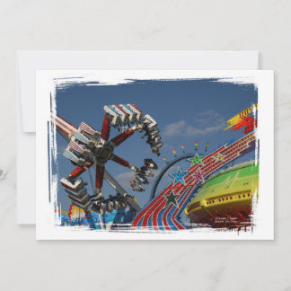 Rides at a county fair against a blue sky