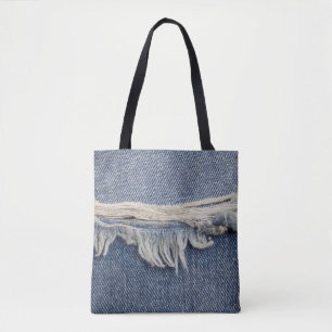 Ripped jeans texture, stylish background. tote bag