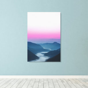 River of fog flowing through mountains at sunrise canvas print