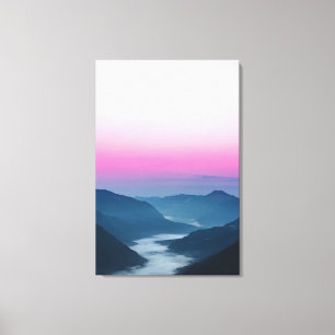 River of fog flowing through mountains at sunrise canvas print