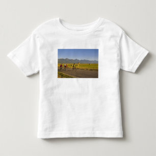 Road bicyclists ride down a back country road toddler T-Shirt
