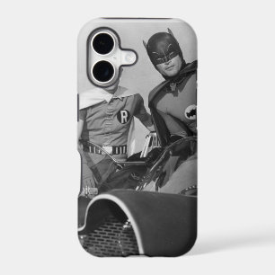 Robin and Batman Standing in Batmobile