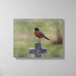 Robin on a cross canvas print