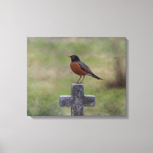 Robin on a cross canvas print