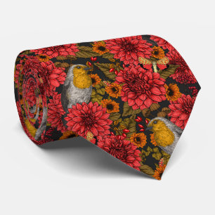 Robins in the autumn garden, red dahlias on black tie