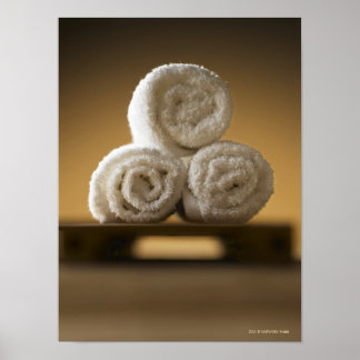 rolled hand towels in a stack poster