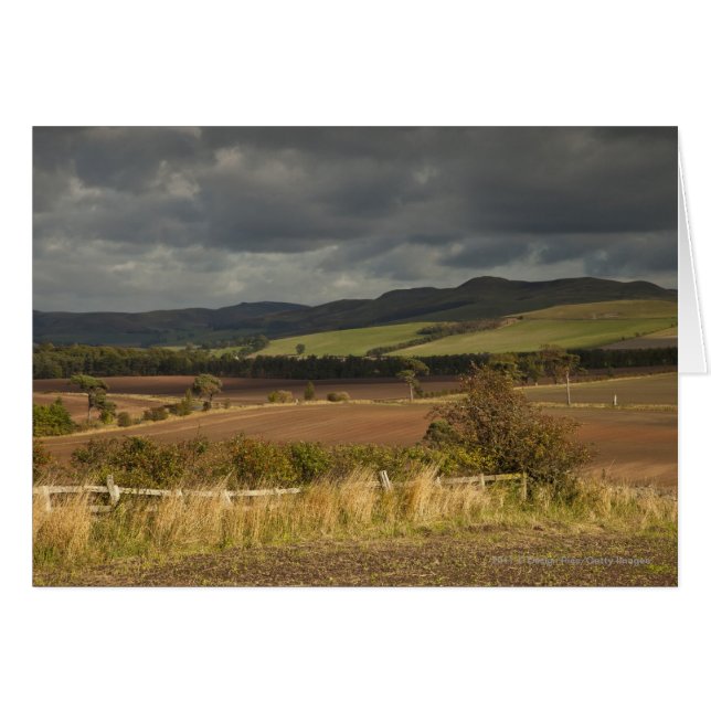 Rolling Hills And Mountains Under A Cloudy Sky (Front Horizontal)