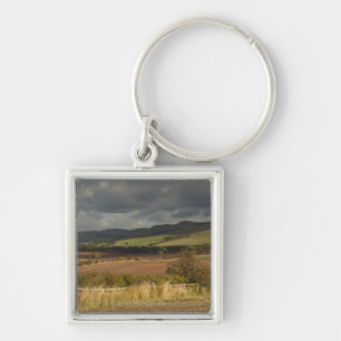 Rolling Hills And Mountains Under A Cloudy Sky Key Ring