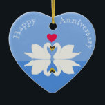 Romantic Anniversary Swan Heart Ceramic Ornament<br><div class="desc">This colourful romantic heart shaped ornament,  is the perfect gift for romantic occasions. It features two swans,  and their reflection,  with a heart between them. The text is editable to make it truly personal. Ideal for wedding anniversaries,  engagement,  newlyweds.</div>