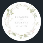 Romantic Blush & Green Floral Wreath Wedding Classic Round Sticker<br><div class="desc">Wedding stickers for envelopes or favours with a watercolor circular wreath of blush pink flowers and green leaves. Personalise with your names and wedding date in grey serif font.</div>