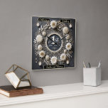 Romantic First Anniversary Wreath Design Square Wall Clock<br><div class="desc">Commemorate your 1st anniversary with a stunning paper wreath featuring handcrafted flowers and elegant origami patterns. The deep black background enhances its elegance,  while soft candlelight and golden “1st Anniversary” text add a romantic glow. A timeless design for keepsakes,  gifts,  or home déco</div>