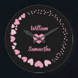 Romantic Heart custom Couple Name Love Large Clock<br><div class="desc">Celebrate love every second with this elegant personalised wall clock featuring a romantic design of pink hearts on a black background. The centre showcases two custom names above and below a heart motif, making it perfect for couples, anniversaries, weddings, or Valentine's Day. A thoughtful gift and a stylish addition to...</div>