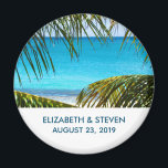 Romantic Turquoise Tropical Beach Wedding Magnet<br><div class="desc">Wedding magnet personalised with your names and date. Designed with a beautiful photograph of a turquoise tropical beach with large green palm fronds framing the scene.</div>