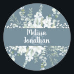 Romantic watercolor floral white flowers wedding   classic round sticker<br><div class="desc">Romantic wedding floral sticker to seal and decorate your wedding invitation envelopes, featuring a delicate watercolor bouquet with white gentle flowers, over greenery, and other botanical foliage. Easily edit the template fields to add your names in a classy white font. View the matching "White Gentle Flowers - Romantic Grey Wedding...</div>