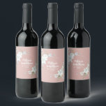 Romantic watercolor white flowers wedding custom wine label<br><div class="desc">Elegant and romantic customisable wine labels for your wedding reception, featuring a beautiful bouquet of white gentle watercolor flowers, over a classy pastel pink background. Easily edit the template fields to add the bride and groom names in a modern white script, and your wedding date in a stylish all-caps font....</div>