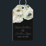 Romantic Watercolor White Ranunculus on Black Gift Tags<br><div class="desc">These romantic floral gift tags feature an elegant black background with watercolor ranunculus flowers. A delicate bouquet of ranunculus and greenery is pictured on the top. Sample names of a newlywed couple and wedding date are printed below. You can personalise the gift tags to include your own custom names or...</div>