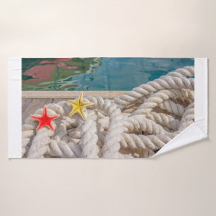 rope for mooring with two starfish on Bath Towels