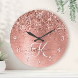 Rose Gold Brushed Metal Glitter Monogram Name Round Clock<br><div class="desc">Easily personalize this trendy chic round clock design featuring pretty rose gold sparkling glitter on a rose gold brushed metallic background.</div>