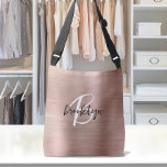 Rose Gold Brushed Metal Script Monogram  Crossbody Bag<br><div class="desc">This elegant personalised crossbody bag features a monogram and first name in modern black and white script on a rose gold faux brushed metal background.</div>