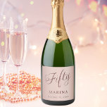 Rose gold name script 50th birthday sparkling wine label<br><div class="desc">Rose gold gradient background. Fifty written with a dark rose gold script.  Personalise and add a name and date.</div>
