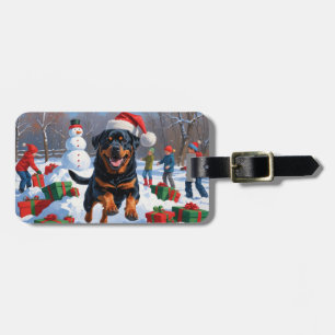 Rottweiler Running in Snow with Christmas Hat Luggage Tag