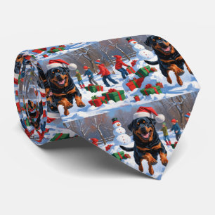 Rottweiler Running in Snow with Christmas Hat Tie