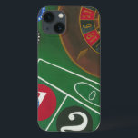 Roulette Table with Chips and Wheel iPhone 13 Case<br><div class="desc">The spinning wheel holds all the power on the roulette table, but the power of this painting is in the lifelike depiction of a casino scene. The green of the felt and the colour of the chips puts you at the table, waiting on your bet to pay off. Be sure...</div>