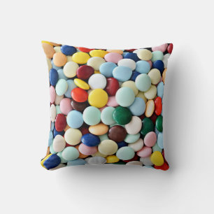 Round candies of different colours cushion