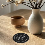 Round Custom Black Business Logo Minimal Paper Coaster<br><div class="desc">A sleek paper coaster featuring a bold black background with a simple framed logo box front and centre. Perfect as a branded accessory for corporate offices,  bars,  cafes,  restaurants,  and promotional giveaways. The logo is fully customisable to showcase your brand.</div>