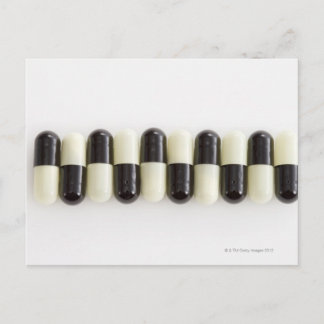 Row of Black and white pills Postcard