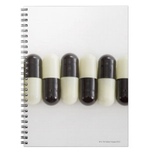 Row of Black and white pills Spiral Notebook