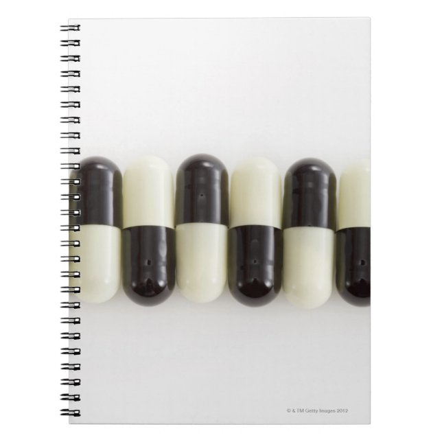 Row of Black and white pills Spiral Notebook (Front)