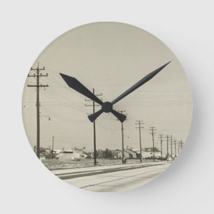 Row of Electricity Poles Round Clock