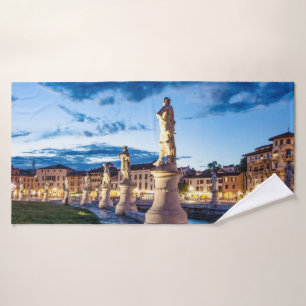 Row of illuminated statues in Padova Bath Towel