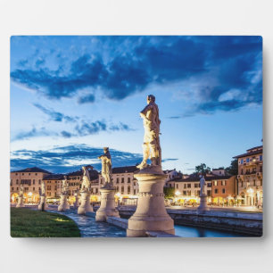 Row of illuminated statues in Padova Plaque