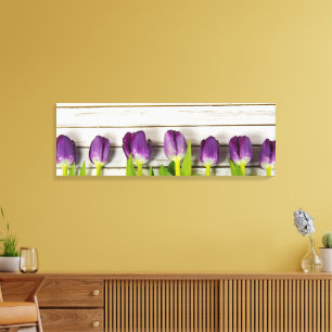 row of purple tulips on wood canvas print