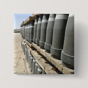 Rows of ammunition are stacked and prepped 15 cm square badge