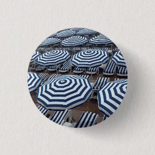 Rows Of Striped Beach Umbrellas With Sun Beds 3 Cm Round Badge