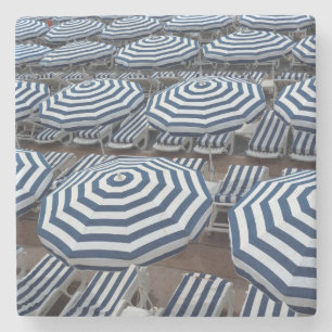 Rows Of Striped Beach Umbrellas With Sun Beds Stone Coaster
