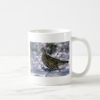 Ruffed grouse standing in snowy woods coffee mug