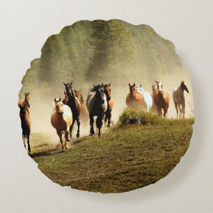 Running horses on Montana ranch Round Cushion
