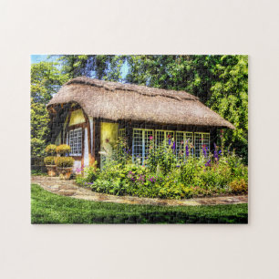 Rural cottage with thatched roof jigsaw puzzle
