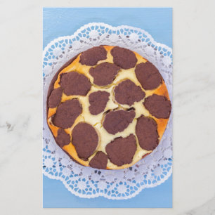 Russian chocolate cheesecake on a blue wooden back