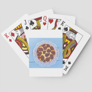Russian chocolate cheesecake on a blue wooden back playing cards