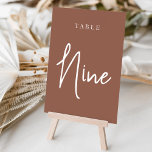 Rust Hand Scripted Table NINE Table Number<br><div class="desc">Simple and chic table number cards in earth tone rust brown and white make an elegant statement at your wedding or event. Design features "table [number]" in an eyecatching mix of classic serif and handwritten script lettering. Design repeats on both sides. Individually numbered cards sold separately; order each table number...</div>