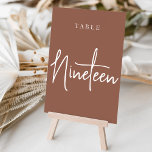 Rust Hand Scripted Table NINETEEN Table Number<br><div class="desc">Simple and chic table number cards in earth tone rust brown and white make an elegant statement at your wedding or event. Design features "table [number]" in an eyecatching mix of classic serif and handwritten script lettering. Design repeats on both sides. Individually numbered cards sold separately; order each table number...</div>